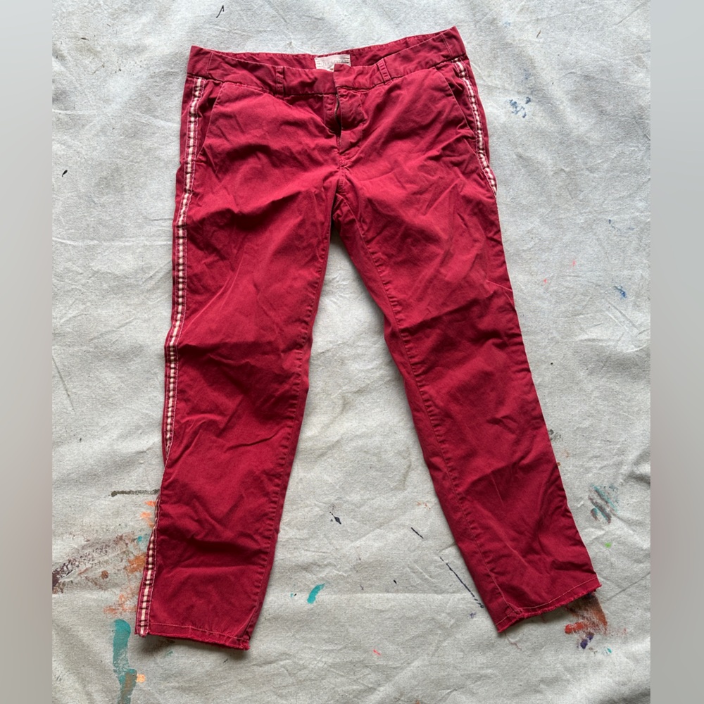Nili Lotan red varsity stripped pants.